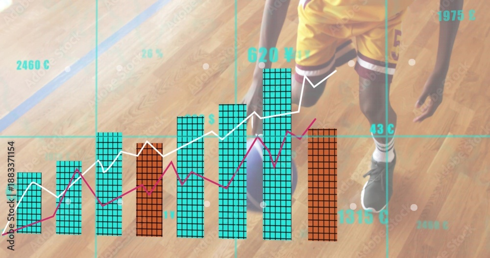 Fototapeta premium Standing teen player wearing yellow kit holding basketball on wood court showing teal orange charts