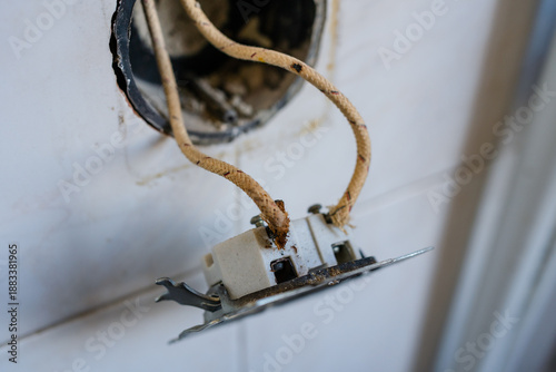 Принти на полотні Close-up of old-fashioned cloth insulated electrical wiring in a wall socket