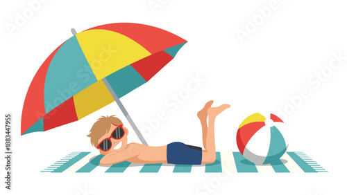 Young boy wearing sunglasses lies on a beach towel under a colorful umbrella and relaxes next to a striped beach ball.