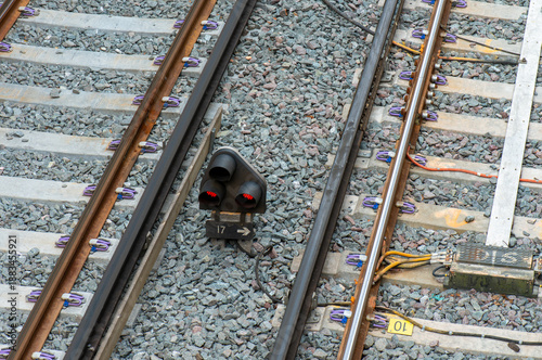 close up of a railway track showing a ground shunting signal placed between the tracks