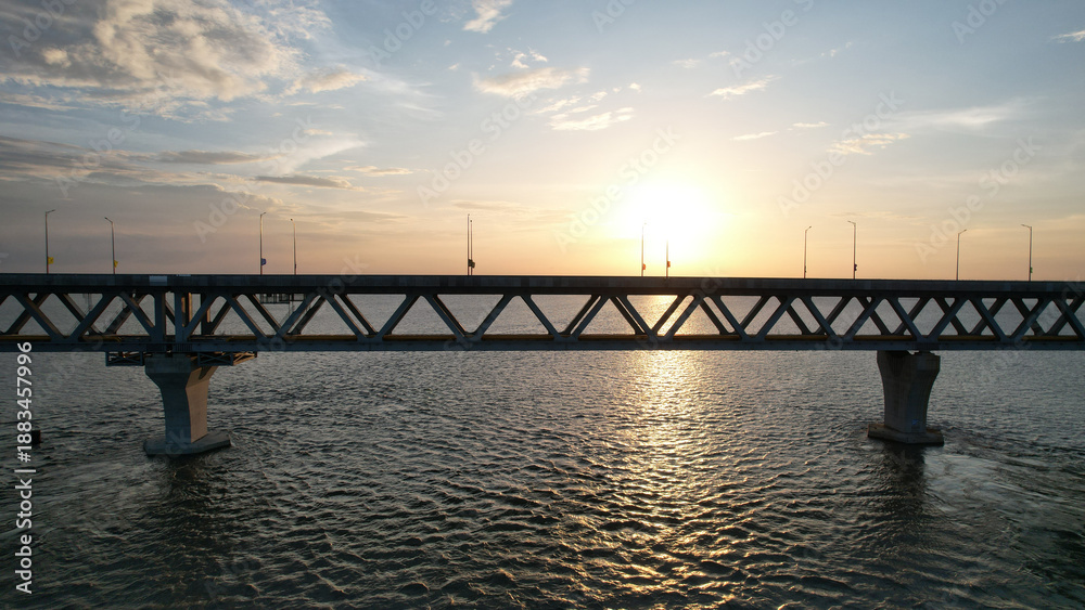 Fototapeta premium Aerial View of Padma Bridge at Sunset Over River, Bangladesh
