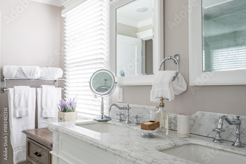 Obraz na płótnie Elegant bathroom vanity with marble countertop, double sink, mirrors, chrome fix