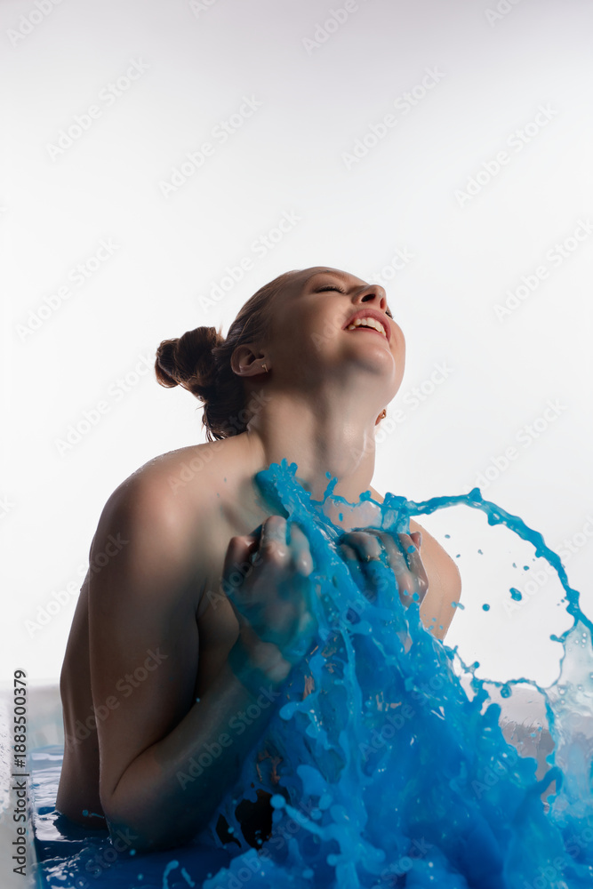 custom made wallpaper toronto digitalElegant woman expressing joy while playing with blue water in a serene setting