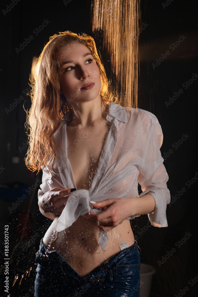 custom made wallpaper toronto digitalWoman with wet shirt poses under water stream in dimly lit environment