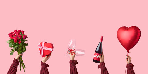 Happy Valentine's day card. Womans hands holding heart shaped baloon, gift box, glasses and wine bottle, roses.