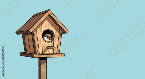 A small, cute bird peeking out from the entrance of a classic wooden birdhouse mounted on a post, with copy space.