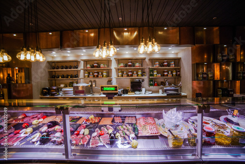 Photos Deli counter showcasing fresh meats charcuterie and gourmet products