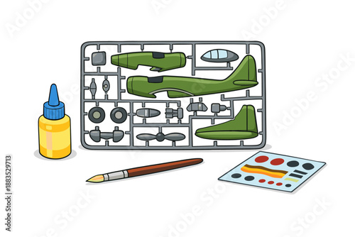 Model airplane kit with paintbrush and glue on white background