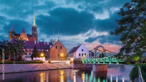 Tumski Bridge (Most Tumski) at dusk in Wroclaw, Poland (static image with animated sky and water)