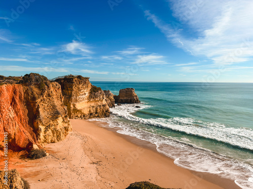beautiful ocean landscape, the coast of Portugal, the Algarve, rocks on the sandy beach, a popular destination for travel in Europe