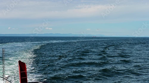 Experience the serenity of a cruise ship gliding across the vast ocean waves near Kunashir. Marvel at the beauty of the Kuril Islands as the sea breeze invites adventure.