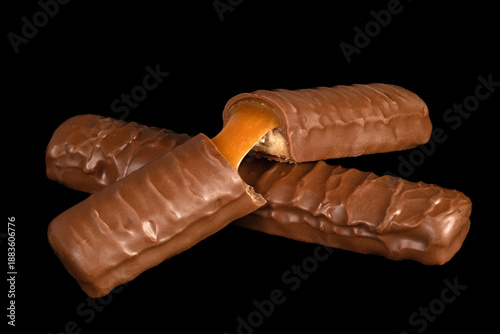 Three chocolate bars with one of them cut in half