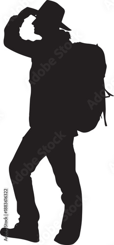 Hiker with backpack on mountain trail at sunset