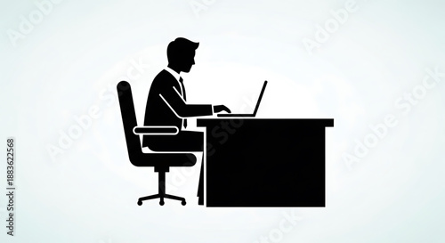 A black silhouette of a man sitting at a desk working on a laptop computer in a simple office setting silhouette