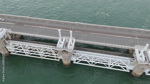 massive coastal defense infrastructure connects land cluster towering wind turbines small harbor inlet located eastern scheldt storm surge barrier netherlands to near 