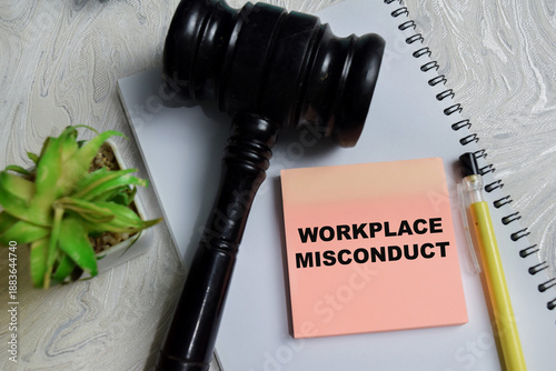 фотографія Concept of workplace misconduct write on sticky notes isolated on Wooden Table