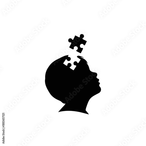 Silhouette of a person's head with puzzle pieces fitting into place.