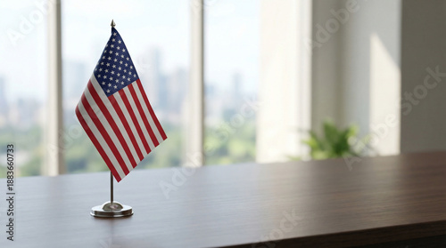 Small American flag proudly displayed on an elegant office desk, symbolizing patriotism, national identity, and business success in a professional corporate environment overlooking a modern city