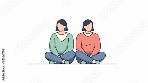 Two women with short dark hair sitting side by side in casual outfits