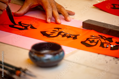the delicate process of creating Spring Couplets through Chinese calligraphy