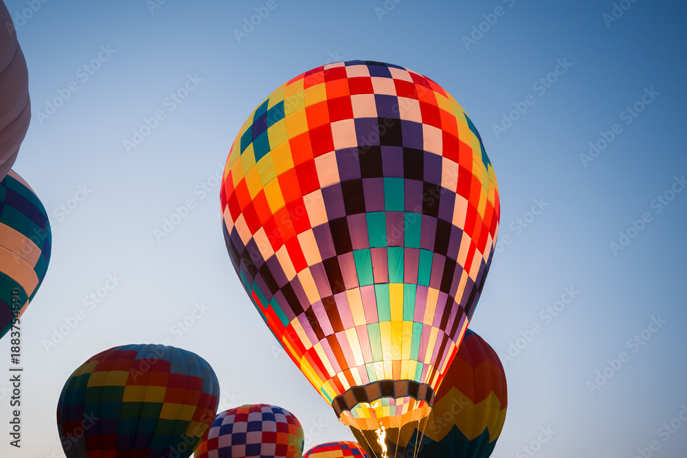 Fototapeta premium colorful hot air balloons glowing against sky