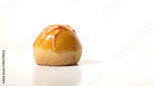 Detail photo of single nastar cake filled with pineapple cream with sliced ​​cheese topping isolated on white background