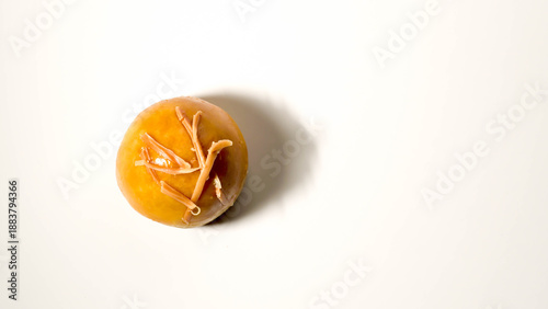 Detail photo of single nastar cake filled with pineapple cream with sliced ​​cheese topping isolated on white background