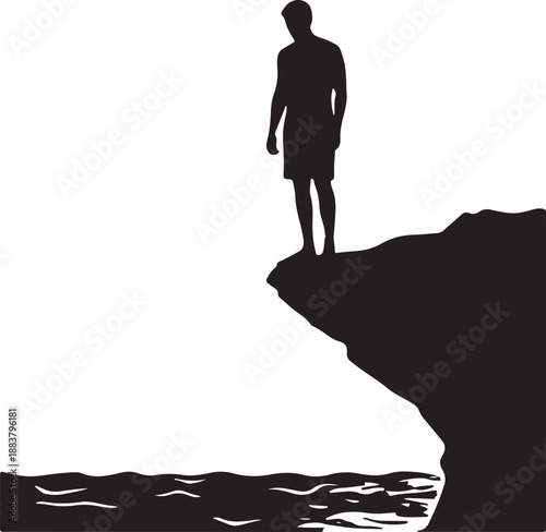 Silhouette of man standing on edge of cliff overlooking ocean.