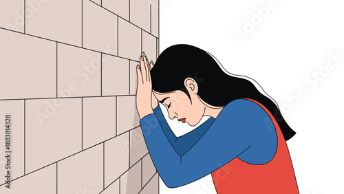 Stressed woman in a blue shirt and red vest leaning her forehead against a brick wall, depicting frustration, depression, or burnout.