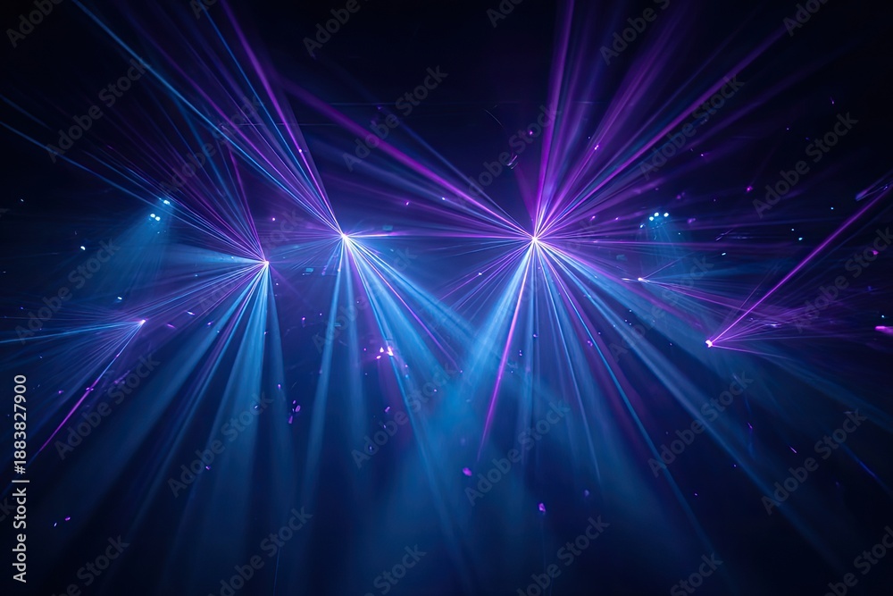 Fototapeta premium Intense blue and purple laser beams burst forth in a dark space, creating a dynamic light show