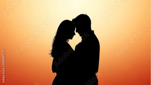Silhouette of a loving couple embracing at sunset.