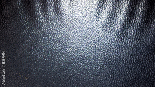 Leather with black relief and backlit with light from the side