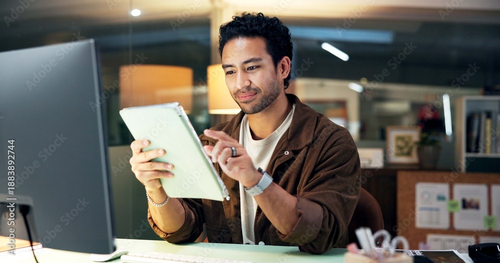 Fototapeta premium Online, reading and man with tablet, office and research for campaign and working late with project. Digital marketing, social media manager and person with tech for deadline and creative at night