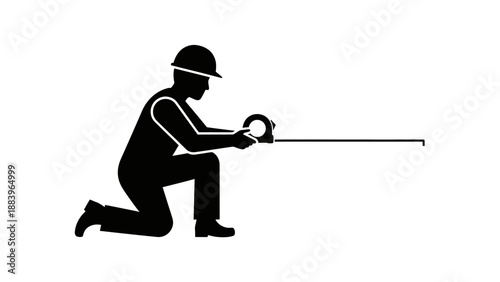 Man kneeling and operating a long tool or equipment.