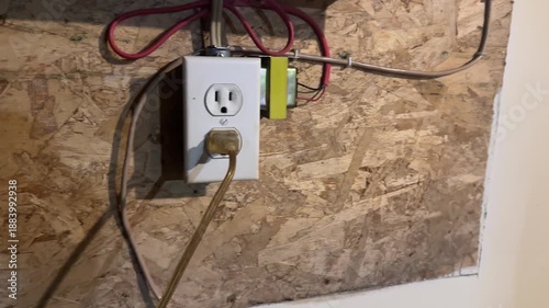 Electric power outlet on a unfinished wall