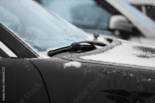 Modern black car with snow ...