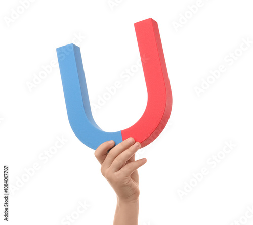 Child's hand with magnet on...