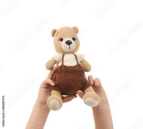Child's hands with toy bear...