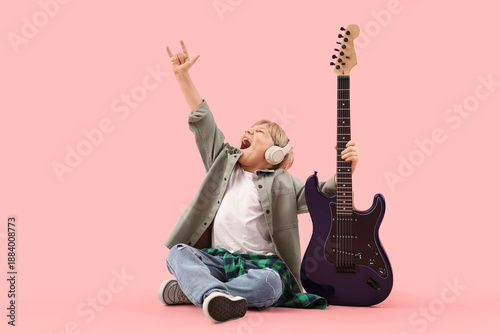Little boy in headphones wi...