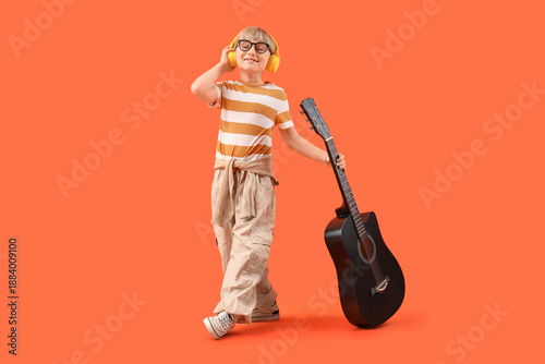 Little boy in headphones wi...