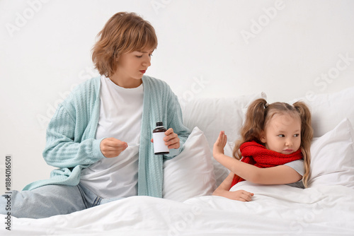 Ill little girl refusing co...