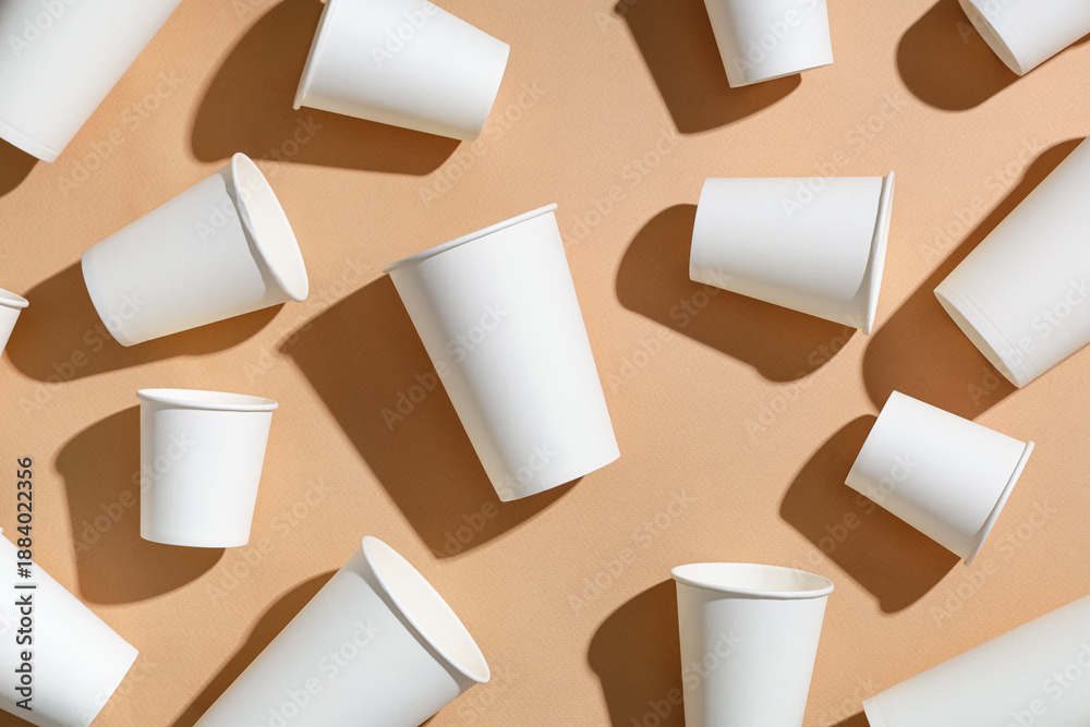 Fototapeta premium Composition with different paper cups on beige background