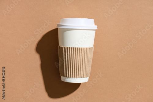 Paper cup on brown backgrou...