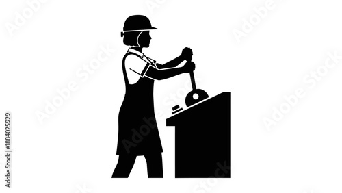 Worker in hard hat using jackhammer.