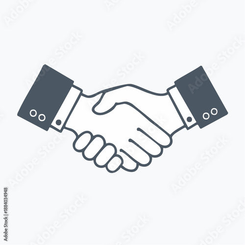 Professional handshake symbolizing partnership and agreement between two business entities in a formal setting