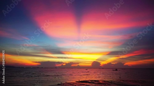 Sunset shines through the clouds with sea surf, Natural phenomenon
