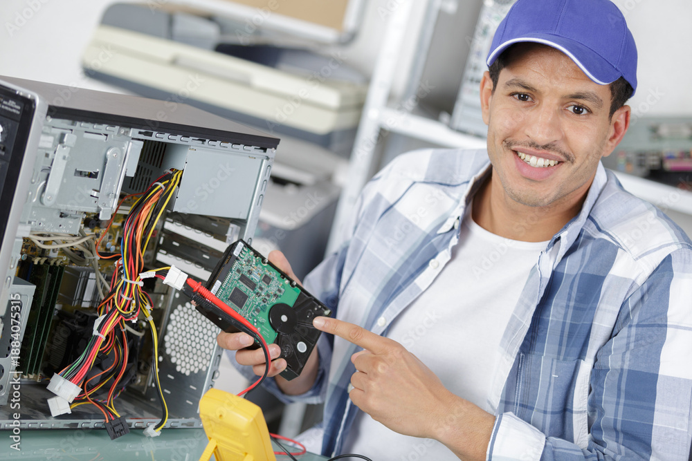 Fototapeta premium a male engineer repairs an electronic board