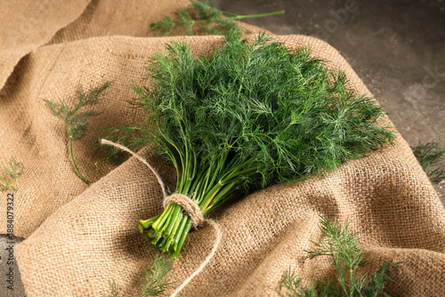 Slika na platnu Bunch of fresh green dill on grey background, closeup