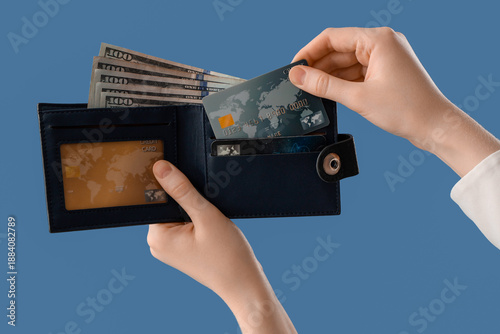 Female hands holding wallet...