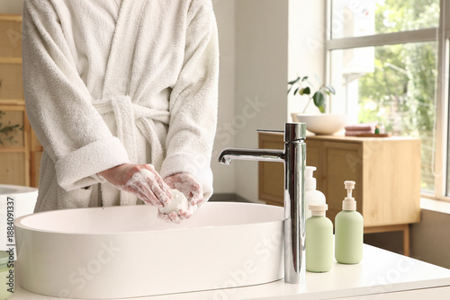 Woman washing her hands wit...